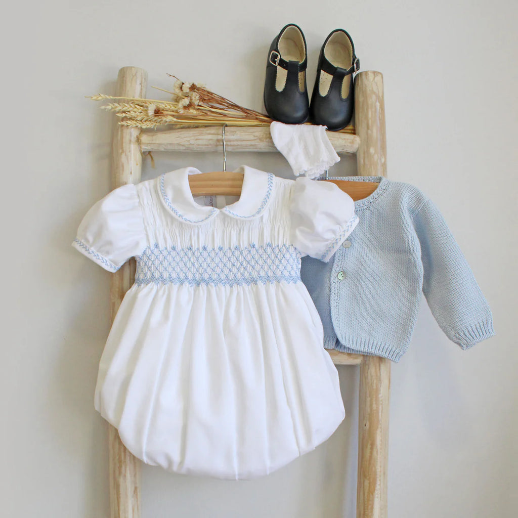 White embroidered romper with blue details