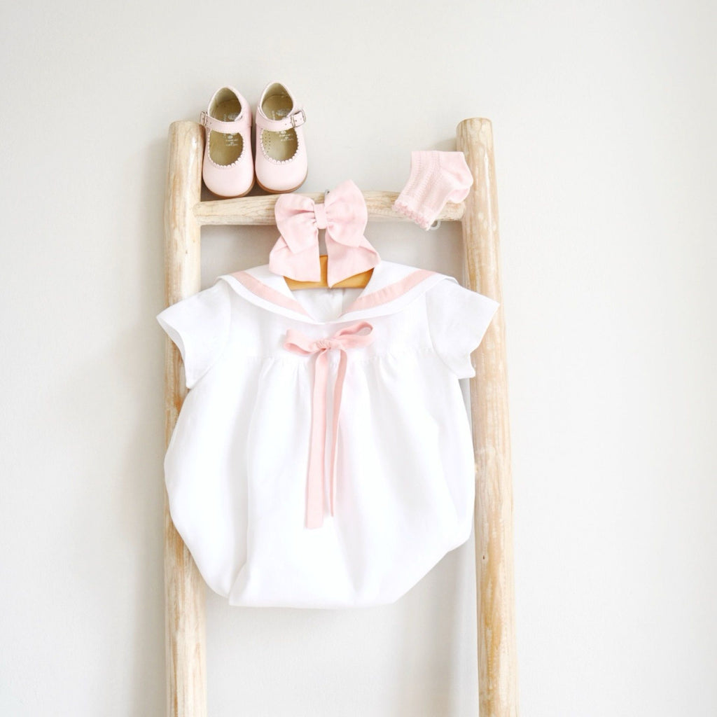 White Sailor romper with pink details